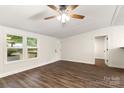 Bright living room with new vinyl floors, fresh white paint, and a ceiling fan at 925 Crestland Dr, Clover, SC 29710