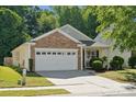 Charming home with a two-car garage and well-maintained lawn at 1622 Candlewood Ridge Ln, Matthews, NC 28105