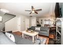 Spacious living room showcasing an open floor plan, hardwood floors, and a seamless flow to the dining area at 17307 Villanova Rd, Huntersville, NC 28078