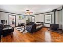 Spacious living room with hardwood floors, fireplace, and black trim at 1917 Tom Sadler Rd, Charlotte, NC 28214