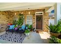 Inviting front porch with seating, plants, and a decorative wreath on the front door at 286 Liverpool Rd, Rock Hill, SC 29730