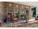 Cozy front porch with brick accents and various plants adding curb appeal at 286 Liverpool Rd, Rock Hill, SC 29730