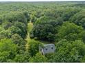 Aerial view of a house surrounded by mature trees, showing a vast wooded landscape at 3387 Passmore Rd, Rock Hill, SC 29730