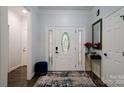 Inviting home foyer with a decorative door, accent furniture, and a stylish rug at 3670 9Th Street Ne Dr # 96, Hickory, NC 28601