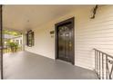 Inviting front porch featuring a black door, black trim, and covered seating area at 10 Bolt Dr, Shelby, NC 28150
