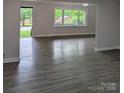 Open living area with new flooring and large windows, showcasing the bright and airy space at 1002 Hemlock Dr, Shelby, NC 28150