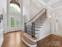Grand foyer boasting hardwood floors, soaring ceilings, and staircase at 1200 Firethorne Club Dr, Waxhaw, NC 28173