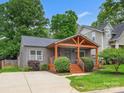 Charming single-story home features a welcoming porch and well-manicured lawn at 1425 Downs Ave, Charlotte, NC 28205