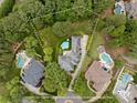 Stunning aerial view of estate featuring a private pool, mature trees and professionally landscaped grounds at 15038 Jockeys Ridge Dr, Charlotte, NC 28277