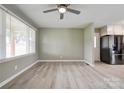 Bright living room with new wood-look floors and modern light fixtures at 1690 Montevista Dr, Shelby, NC 28150