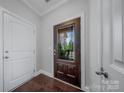A welcoming foyer featuring a decorative glass door and hardwood flooring, setting an elegant tone for the home at 204 Aztec Cir, Mooresville, NC 28117