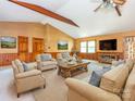 Spacious living room with vaulted ceilings, a ceiling fan, and comfortable seating arrangement perfect for relaxation at 2222 Hearthstone Dr, Gastonia, NC 28056