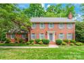 Classic two-story brick home with gray shutters, landscaping, and inviting front entrance at 2730 Tiffany Dr, Rock Hill, SC 29732