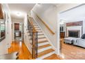 Inviting foyer with hardwood floors, staircase with iron spindles, and views into the living spaces at 2730 Tiffany Dr, Rock Hill, SC 29732