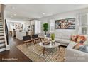 Inviting living room with a large rug, comfortable seating, and an open-concept design at 3009 Loso Ter # 58, Charlotte, NC 28217