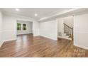Spacious basement featuring wood-look floors and neutral paint, perfect for entertaining and relaxing at 3101 Willowbrae Rd, Charlotte, NC 28226