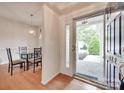 Bright foyer with hardwood floors, dining area, and clear view of the front porch, providing a warm welcome at 422 Garnet Ct, Fort Mill, SC 29708
