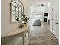 Inviting entryway with stylish console table, decorative mirror, and views into a spacious living room at 509 Silers Bald Dr, Fort Mill, SC 29715