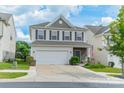 Attractive two-story home with a well-maintained lawn, two-car garage, and inviting curb appeal at 509 Silers Bald Dr, Fort Mill, SC 29715