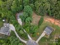 Expansive aerial view of a neighborhood showcasing lush greenery and well-maintained homes with ample outdoor space at 5308 Lambert Ct, Waxhaw, NC 28173