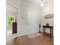 Welcoming foyer featuring hardwood floors, wainscoting, and neutral paint, creating a bright and inviting entrance at 5308 Lambert Ct, Waxhaw, NC 28173