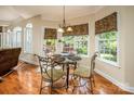 Cozy breakfast nook with a glass table and backyard view, perfect for relaxed dining at 7245 Willow Brook Ct, Denver, NC 28037