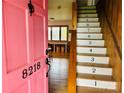 Inviting foyer with a numbered staircase and a glimpse into a bright, open living space at 8218 Bright Water Ln, Denver, NC 28037