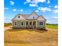 Inviting home with a well-manicured lawn, attractive architectural details, and a bright, welcoming facade at Lot 101 Coppergate Dr, Salisbury, NC 28147