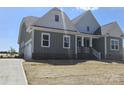 New construction home with covered porch, attached garage, and a fresh, modern design at Lot 101 Coppergate Dr, Salisbury, NC 28147