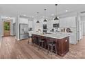 Spacious open kitchen featuring a large island, stainless steel appliances, and modern pendant lighting at Lot 101 Coppergate Dr, Salisbury, NC 28147