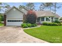 Charming single Gathering home with a well manicured front yard and mature trees at 104 Gallarie Pl, Salisbury, NC 28144