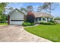 Charming single Gathering home with a well manicured front yard and mature trees at 104 Gallarie Pl, Salisbury, NC 28144