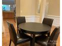 Cozy dining area with a round table and chairs, adjacent to the kitchen, great for Gathering meals at 10817 Bere Island Dr, Charlotte, NC 28278