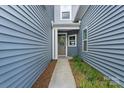 Inviting front entrance with a charming 'Welcome' sign on the door at 1108 Stella Ct, Monroe, NC 28110