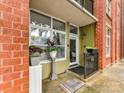 Charming front porch with plants and a 'Welcome' mat leading to a bright and inviting entrance at 1320 Fillmore Ave # 137, Charlotte, NC 28203