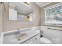 Cozy bathroom with a vanity, window, and a shower/tub at 1415 Midlake Rd, Kannapolis, NC 28083