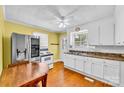 Functional kitchen featuring white cabinets and stainless steel refrigerator at 1415 Midlake Rd, Kannapolis, NC 28083