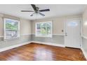 Bright living room featuring hardwood floors and natural light from the windows at 1415 Midlake Rd, Kannapolis, NC 28083