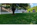 Exterior view of a single-story home with landscaped yard and parking at 142 Sandra Dr, Statesville, NC 28625