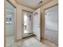 Inviting foyer with neutral tile flooring, a half glass front door and views into the living room at 1866 Charter Dr, Rock Hill, SC 29732