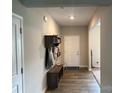 Inviting foyer boasts wood-look flooring and a convenient drop zone for coats and shoes at 348 Ox Bow Cir, Mount Holly, NC 28120