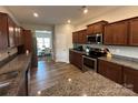 Spacious kitchen features granite countertops, stainless steel appliances, and ample cabinet space at 348 Ox Bow Cir, Mount Holly, NC 28120