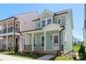 Charming two-story home with a welcoming front porch and beautiful curb appeal at 5820 Pittmon Ln, Kannapolis, NC 28081