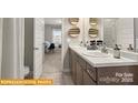 Modern bathroom with dual vanities, framed mirrors, and stylish decor for a spa-like retreat at 6443 Honor Ave, Midland, NC 28107
