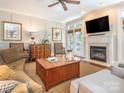 Comfortable living room with a fireplace, plush seating, and stylish decor at 7040 Edenderry Dr, Charlotte, NC 28270