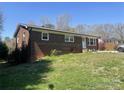 Well-maintained brick home featuring a clean front lawn and white trimmed windows at 739 Owls Den Rd, Lincolnton, NC 28092
