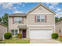 Charming two-story home with a well-maintained lawn and attached two-car garage at 9718 Eagle Feathers Dr, Charlotte, NC 28214