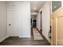 Inviting entryway with wood-look floors, leads to the spacious living area with lots of natural light at 105 Chase View Ln, Troutman, NC 28166