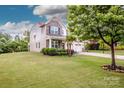 Well-maintained two-story home with a spacious lawn, a two-car garage, and charming curb appeal at 130 Bay Laurel Dr, Mooresville, NC 28115