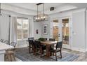 Bright dining room with a wooden table, seating for six, and a view of the outdoors at 1634 Dresden Dr, Rock Hill, SC 29732